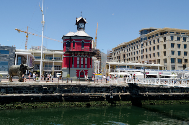 The historic Clock Tower, adjacent to the Robben Island ferry and the aptly-named "Swing Bridge." Photo © 2013 Aaron Saunders