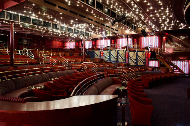 One of my favorite public rooms (so far) is the stunning Parisien Show Lounge, which spans two decks in height and is flanked by windows. A great design! Photo © 2013 Aaron Saunders