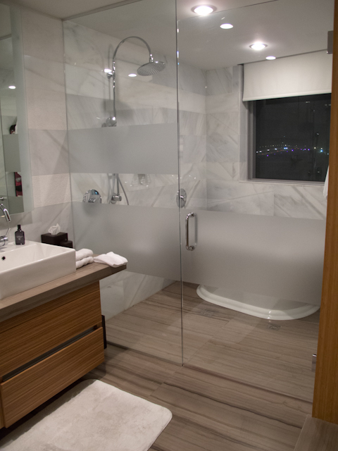 Bathrooms include separate vanity areas, along with separate showers, standalone tubs and waterclosets. Photo © 2012 Aaron Saunders